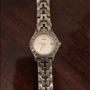 Seiko watch. authentic.  Diamonds around face.